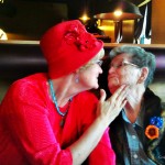 Mary and Dena Kleinsorge share a birthday kiss